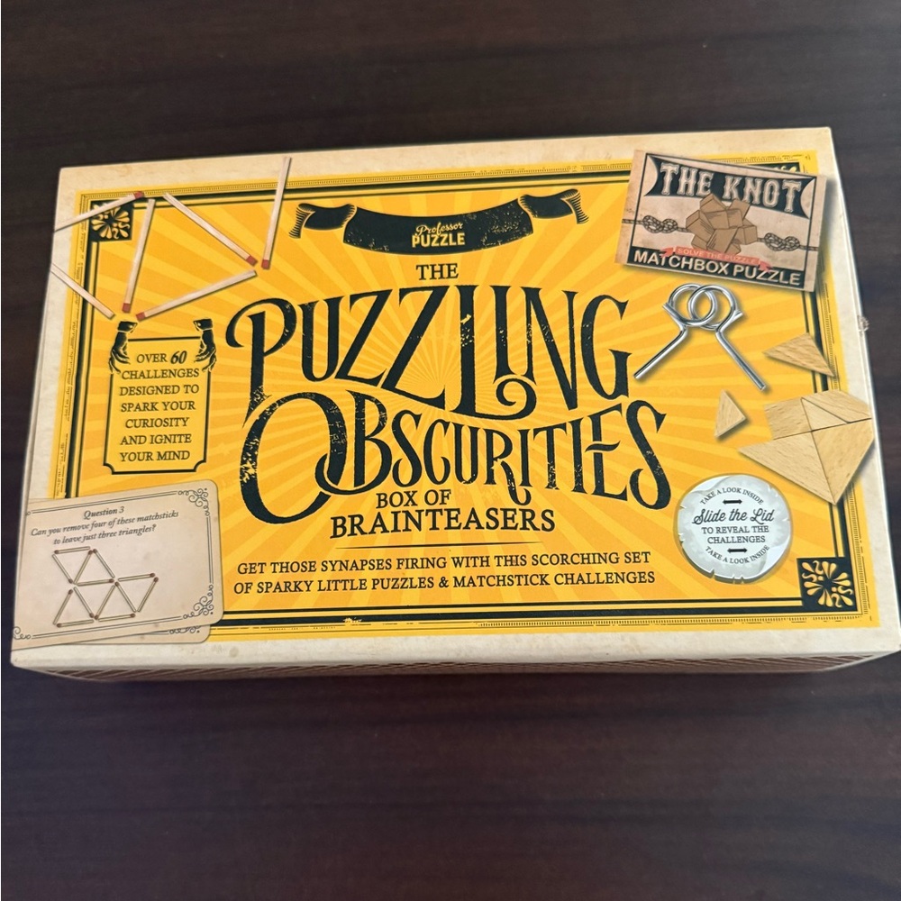NEW!! The Puzzling Obscurities box of brainteasers. Over 60 challenges!